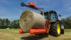 RW 1200 3 point bale wrapper, grabs a bale for wrapping.