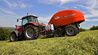 KUHN i-BIO+ round baler-wrapper combination at work