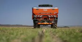 AXIS 40.2 H-EMC-W fertiliser spreader at work