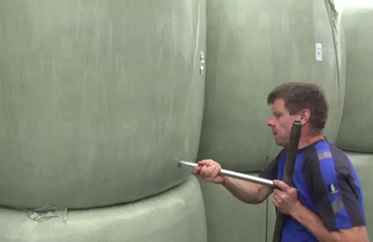 a men taking a test from a bale