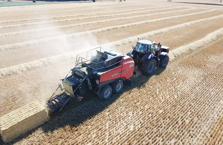 SB 1290 iD baling in a straw field