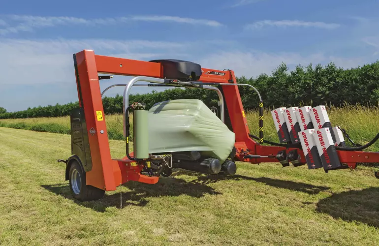 SW 4014 wrapping a big bale