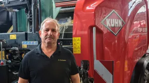 Photo of Uwe Schulze with baler-wrapper in background