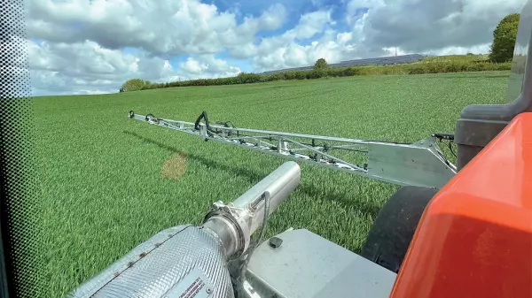 Photo taken from the cab of the ARTEC RS20 self-propelled sprayer with a view of the boom