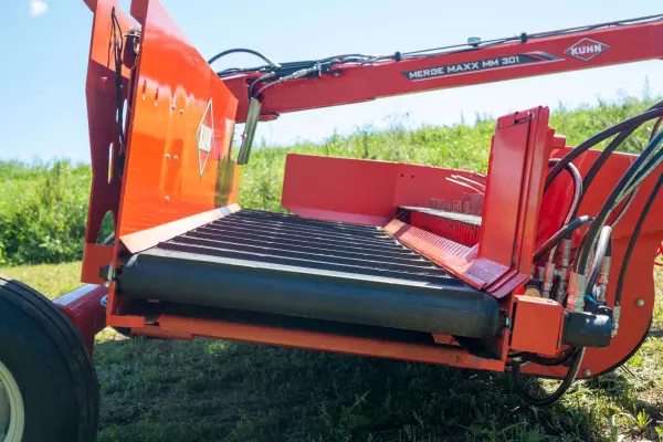 The heavy-duty conveyor on a KUHN Merge Maxx 300 hay merger.