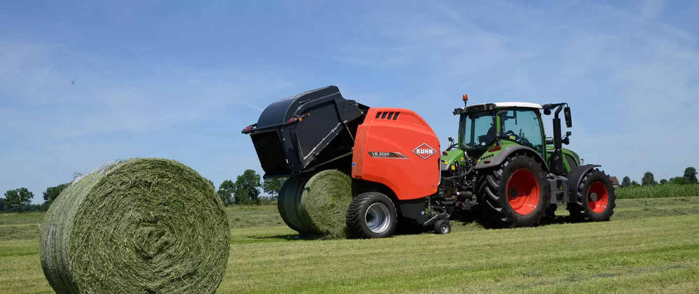 KUHN VB 3260 series round baler baling in the field