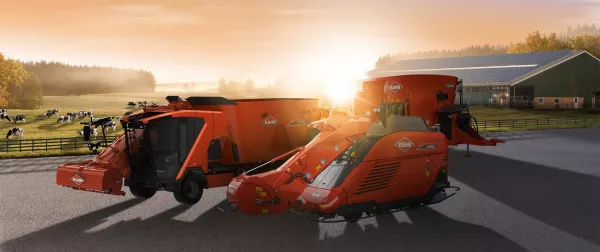 Das Keyvisual der KUHNaktuell. Fütterungstechnik 2026, welches KUHN Fütterungstechnik vor einem Sonnenuntergang darstellt.