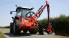 Transport position of the KUHN AGRI-LONGER GII Hedge and Grass Cutter with pivot-mounted arm safety