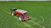 AXENT 90.1 fertiliser spreader in action