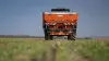 AXIS 40.2 H-EMC-W fertiliser spreader at work