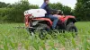 EVOLIS quad-mounted sprayer at work in a maize field