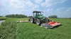 A PZ 300 F mowing grass in combination with a PZ mower in the back on a flat pasture.