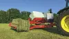 The SW 1614 C carries a second bale in the loading arm during wrapping.